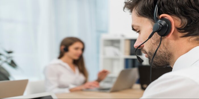 A man wearing a headset representing customer support